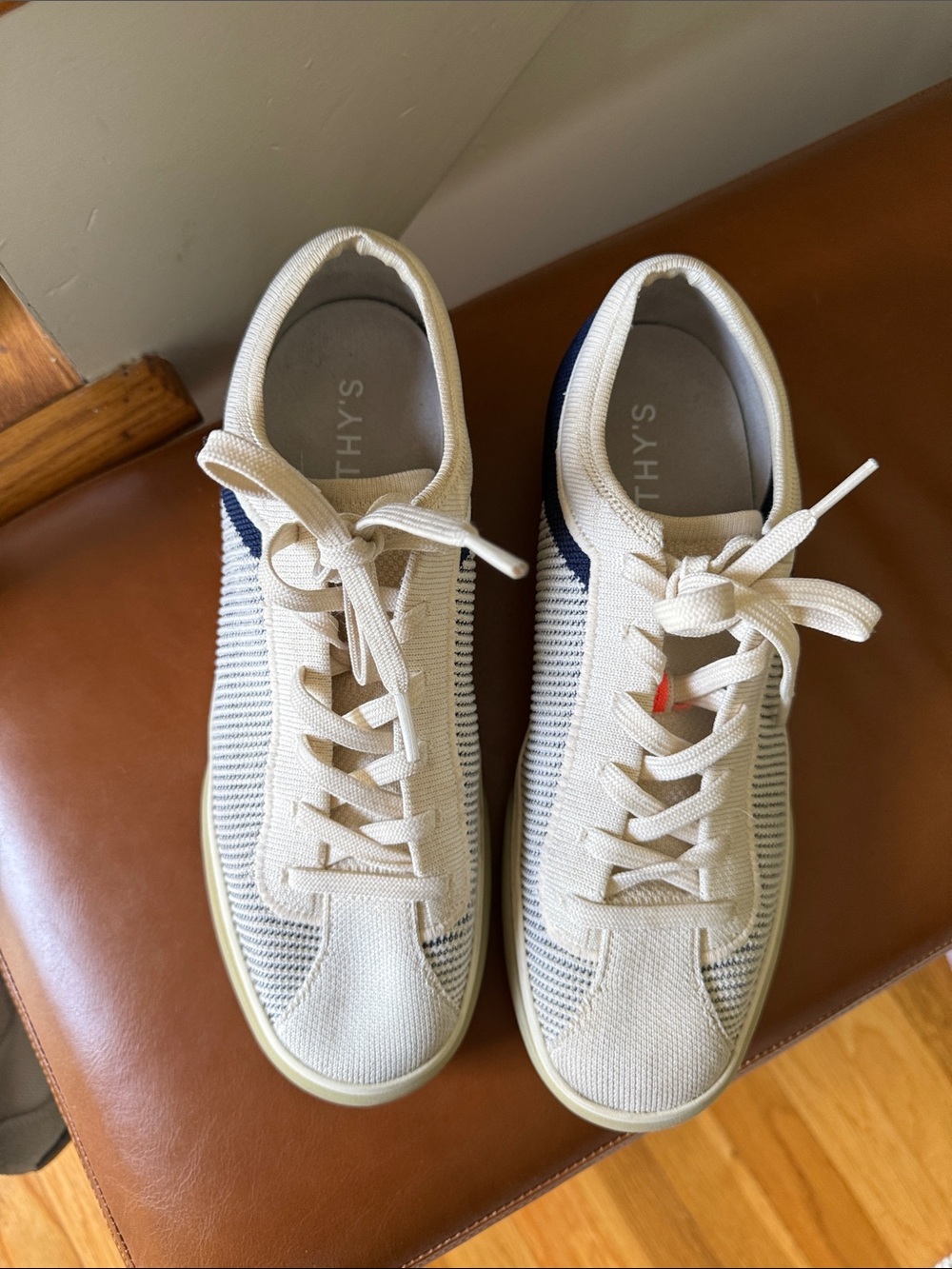 Rothy’s Knit Low-Top Sneakers in Cream and Navy with Orange Accents